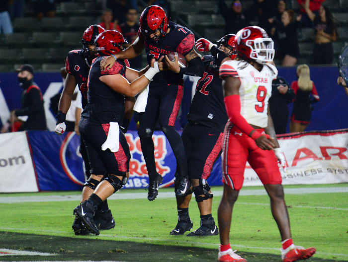 San Diego State Aztecs quarterback Lucas Johnson (7) celebrates after catching a pass for two-point conversion.